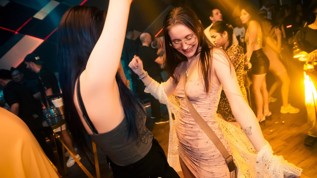 Group photo of partygoers at a premium nightclub in Bangkok