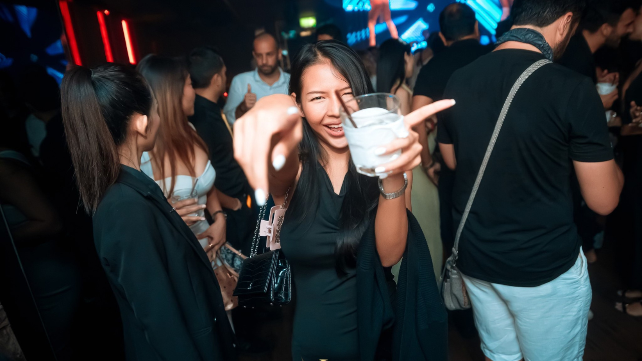 Tourists having drinks and making friends at a Sukhumvit bar