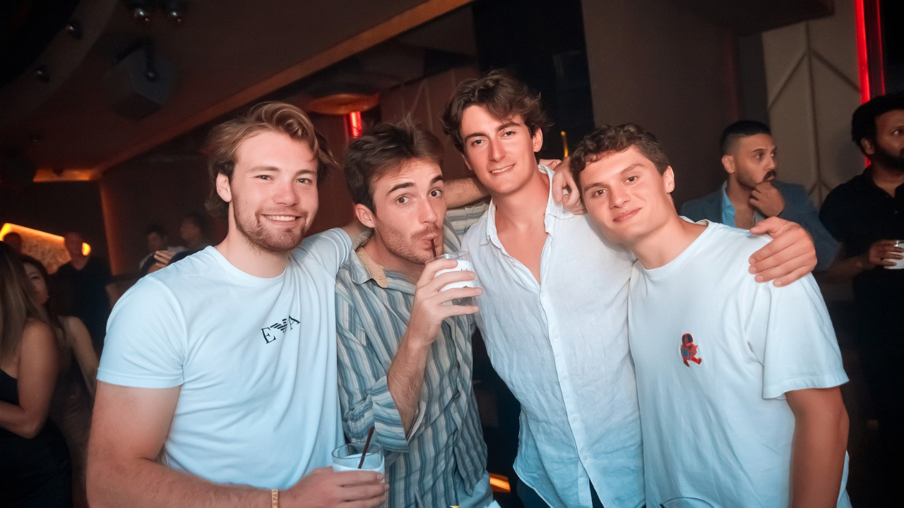 Excited crowd partying on a VIP Bangkok pub crawl experience